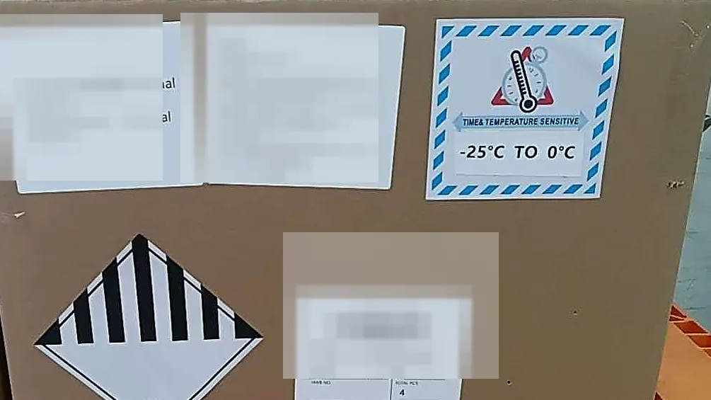 Masked special cargo carton with dangerous goods and temperature-sensitive labels